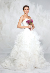 Bride standing with flowers